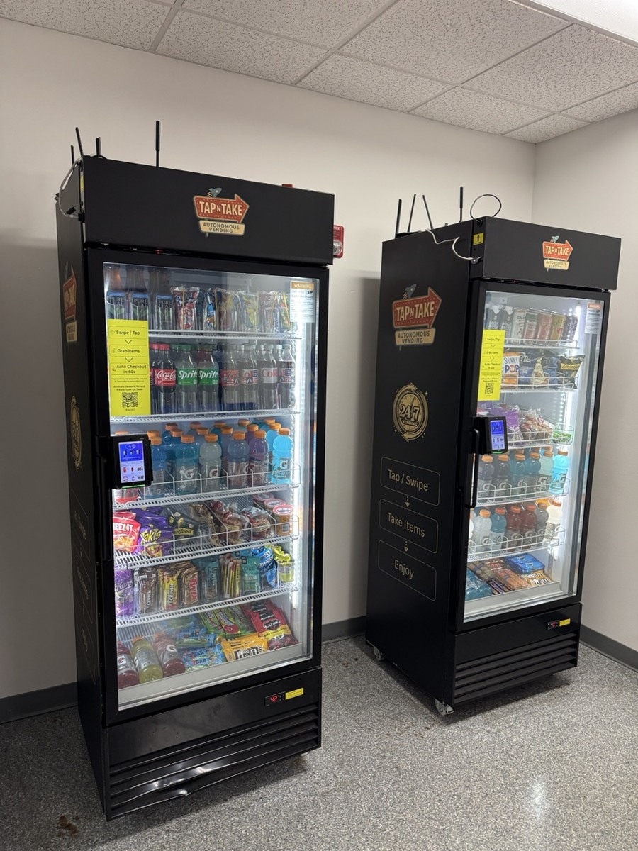 Two Tap N Take smart vending coolers stocked with drinks and snacks in the break room at the YMCA Southeast Branch in Bloomington, Indiana